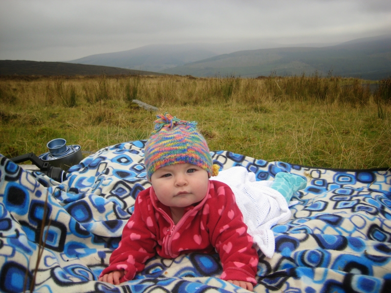 baby on blanket outside